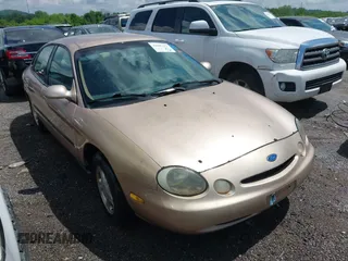 1997 Ford Taurus GL z VIN 1FALP52U9VA280563, wystawiony jako IAAI lot #42045413 z przebiegiem 219 484 mil mil oraz . Historia ofert i sprzedaży dostępna na DreamBid. Obrazek 1.