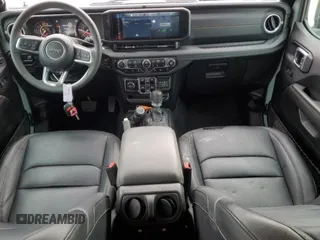 2024 Jeep Wrangler Sahara with VIN 1C4PJXENXRW153777, listed as a Copart auction lot 46066605 with 16,707 mi miles and Salvage Title. Bid and sale history available at DreamBid. Image 8.