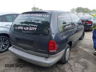 1996 Dodge Caravan Sport with VIN 2B4GP4439TR803645, listed as a IAAI auction lot 42122379 with 185,159 mi miles and . Bid and sale history available at carsss.com. Image 4.