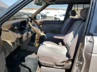 1992 Mazda MPV z VIN JM3LV5222N0453058, wystawiony jako Copart lot #72283634 z przebiegiem 174 084 mil mil oraz Szkody całkowita. Historia ofert i sprzedaży dostępna na DreamBid. Obrazek 7.