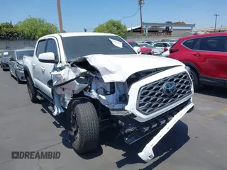 2023 Toyota Tacoma SR with VIN 3TMCZ5AN7PM556274, listed as a IAAI auction lot 42588102 with 28,378 mi miles and . Bid and sale history available at DreamBid. Image 1.