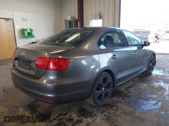 2014 Volkswagen Jetta Sedan S with VIN 3VW2K7AJ5EM410491, listed as a IAAI auction lot 42083614 with 65,960 mi miles. Bid and sale history available at carsss.com. Image 4.