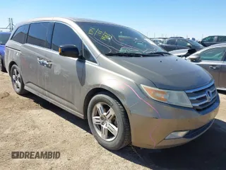 2011 Honda Odyssey Touring with VIN 5FNRL5H95BB050170, listed as a IAAI auction lot 41723697 with 203,706 mi miles and . Bid and sale history available at DreamBid. Image 1.