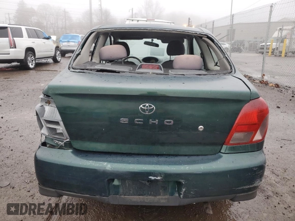 2000 Toyota ECHO with VIN JTDAT1231Y0041399, listed as a Copart auction lot 83774514 with 128,465 mi miles and Salvage Title. Bid and sale history available at DreamBid. Image 6.