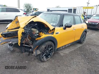2015 MINI Hardtop 4 Door z VIN WMWXS5C54FT833253, wystawiony jako IAAI lot #42247647 z przebiegiem Nie podano mil oraz . Historia ofert i sprzedaży dostępna na DreamBid. Obrazek 16.