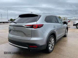 2017 Mazda CX-9 Grand Touring with VIN JM3TCADY7H0136915, listed as a Copart auction lot 57106855 with 135,872 mi miles and Clean title. Bid and sale history available at DreamBid. Image 4.