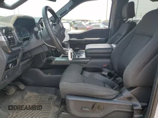 2023 Ford F-150 XL with VIN 1FTEW1EP7PFB66555, listed as a Copart auction lot 59384665 with 28,495 mi miles and Salvage title. Bid and sale history available at DreamBid. Image 7.