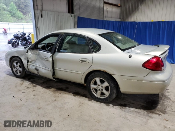 2003 Ford Taurus SE Standard z VIN 1FAFP532X3A195612, wystawiony jako Copart lot #54016645 z przebiegiem 143 168 mil mil oraz Szkoda całkowita • Salvage title. Historia ofert i sprzedaży dostępna na DreamBid. Obrazek 2.