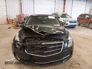 2016 Cadillac ATS AWD z VIN 1G6AG1RX2G0167642, wystawiony jako IAAI lot #41708537 z przebiegiem 217 560 mil mil oraz . Historia ofert i sprzedaży dostępna na DreamBid. Obrazek 12.