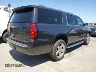 2018 Chevrolet Suburban Premier with VIN 1GNSCJKC4JR189639, listed as a Copart auction lot 64221035 with 110,256 mi miles and Salvage title. Bid and sale history available at DreamBid. Image 3.
