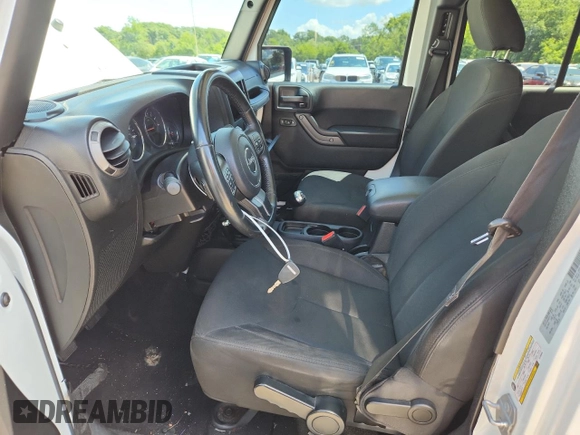 2015 Jeep Wrangler Unlimited Freedom with VIN 1C4HJWDGXFL755528, listed as a Copart auction lot 64927525 with 111,096 mi miles and Salvage title. Bid and sale history available at DreamBid. Image 7.
