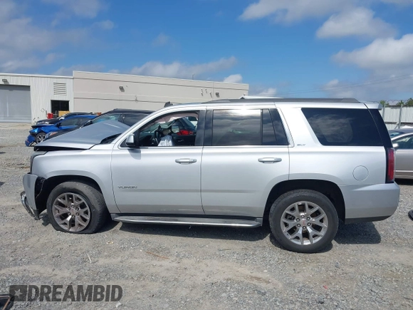 2015 GMC Yukon SLT z VIN 1GKS2BKC0FR100064, wystawiony jako IAAI lot #41941462 z przebiegiem 136 740 mil mil oraz . Historia ofert i sprzedaży dostępna na DreamBid. Obrazek 14.
