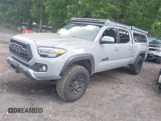 2021 Toyota Tacoma SR5 with VIN 3TMDZ5BN3MM112338, listed as a IAAI auction lot 42241704 with 81,346 mi miles and . Bid and sale history available at DreamBid. Image 2.