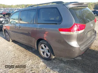 2011 Toyota Sienna LE AAS with VIN 5TDKK3DC9BS100414, listed as a IAAI auction lot 41901835 with 186,634 mi miles and . Bid and sale history available at DreamBid. Image 3.