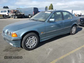 1998 BMW 3 Series 318i with VIN WBACC9322WEE60455, listed as a Copart auction lot 75950324 with 328,714 mi miles and Salvage Title. Bid and sale history available at carsss.com. Image 1.