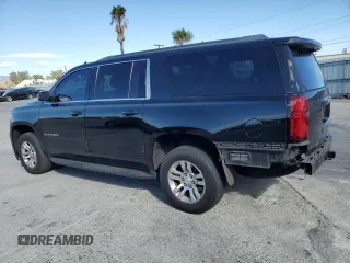 2017 Chevrolet Suburban LS with VIN 1GNSCGECXHR351539, listed as a Copart auction lot 87070214 with 246,129 mi miles and Salvage title. Bid and sale history available at DreamBid. Image 2.