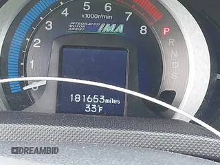 2010 Honda Insight EX with VIN JHMZE2H71AS035091, listed as a IAAI auction lot 41380128 with 181,653 mi miles and . Bid and sale history available at DreamBid. Image 16.