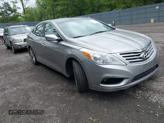 2013 Hyundai Azera z VIN KMHFH4JG7DA229860, wystawiony jako IAAI lot #42391312 z przebiegiem 151 503 mil mil oraz . Historia ofert i sprzedaży dostępna na DreamBid. Obrazek 1.