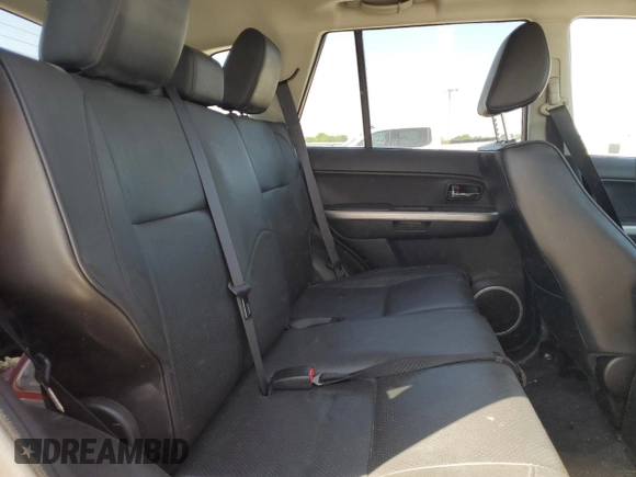 2011 Suzuki Grand Vitara Limited z VIN JS3TE0D72B4100054, wystawiony jako Copart lot #52535705 z przebiegiem 131 468 mil mil oraz Szkoda całkowita • Salvage title. Historia ofert i sprzedaży dostępna na DreamBid. Obrazek 10.