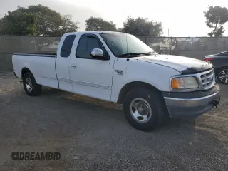 1999 Ford F-150 XL with VIN 1FTRX17L6XNA06844, listed as a Copart auction lot 83109004 with Not Provided miles and Salvage Title. Bid and sale history available at carsss.com. Image 4.