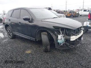 2016 Mazda CX-5 Grand Touring z VIN JM3KE4DY5G0742686, wystawiony jako IAAI lot #41598719 z przebiegiem 117 643 mil mil oraz . Historia ofert i sprzedaży dostępna na DreamBid. Obrazek 1.