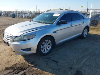 2011 Ford Taurus SE with VIN 1FAHP2DWXBG172965, listed as a IAAI auction lot 41395638 with 147,098 mi miles. Bid and sale history available at carsss.com. Image 2.
