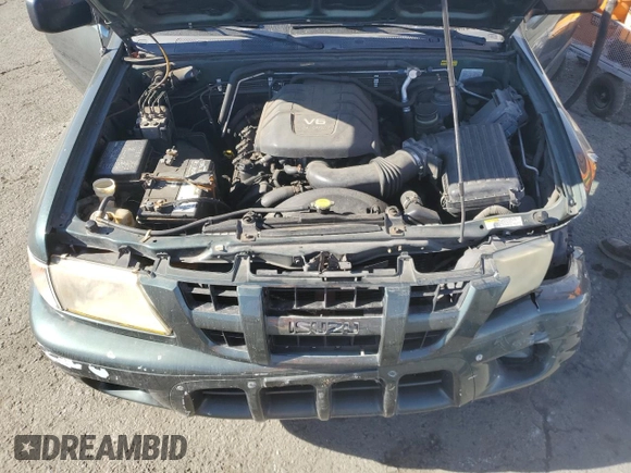2004 Isuzu Rodeo S with VIN 4S2CK58W344303242, listed as a Copart auction lot 75339714 with 106,659 mi miles and Salvage title. Bid and sale history available at DreamBid. Image 14.