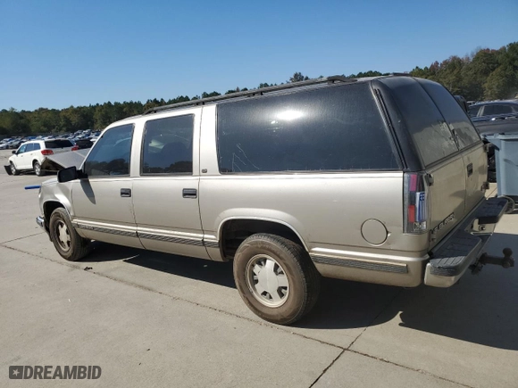 1999 GMC Suburban with VIN 3GKEC16R7XG542862, listed as a Copart auction lot 77568734 with 251,717 mi miles and Salvage Title. Bid and sale history available at carsss.com. Image 2.