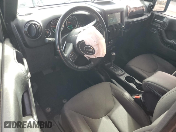 2017 Jeep Wrangler Willys Wheeler with VIN 1C4AJWAG1HL624254, listed as a Copart auction lot 42678975 with 51,936 mi miles and Salvage Title. Bid and sale history available at DreamBid. Image 8.