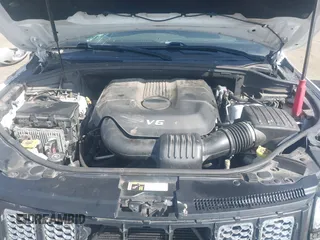 2015 Jeep Grand Cherokee Summit with VIN 1C4RJFJGXFC734025, listed as a IAAI auction lot 41842927 with 137,993 mi miles. Bid and sale history available at carsss.com. Image 10.