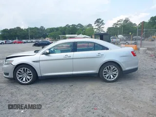 2015 Ford Taurus Limited with VIN 1FAHP2F89FG182598, listed as a IAAI auction lot 42222372 with 124,627 mi miles and . Bid and sale history available at DreamBid. Image 14.
