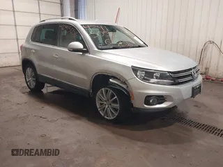 2012 Volkswagen Tiguan SE with VIN WVGBV7AX8CW575846, listed as a IAAI auction lot 42415056 with 98,696 mi miles and . Bid and sale history available at DreamBid. Image 1.