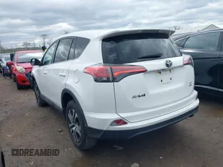 2018 Toyota RAV4 LE with VIN 2T3BFREVXJW793174, listed as a IAAI auction lot 42037936 with 82,304 mi miles. Bid and sale history available at carsss.com. Image 3.