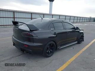 2013 Mitsubishi Lancer Evolution GSR with VIN JA32W8FV8DU012080, listed as a IAAI auction lot 41379744 with 95,070 mi miles. Bid and sale history available at carsss.com. Image 4.