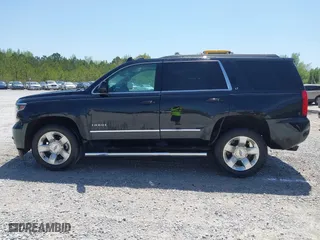 2019 Chevrolet Tahoe LT with VIN 1GNSCBKC4KR231153, listed as a IAAI auction lot 42017325 with 116,960 mi miles. Bid and sale history available at carsss.com. Image 14.