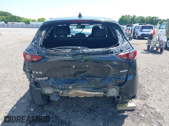 2020 Mazda CX-5 Grand Touring with VIN JM3KFADM9L1837183, listed as a IAAI auction lot 42340628 with 81,975 mi miles and . Bid and sale history available at DreamBid. Image 16.