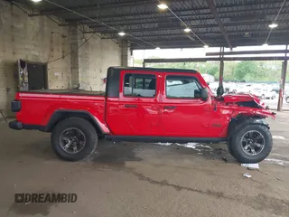2021 Jeep Gladiator Willys z VIN 1C6HJTAG7ML602130, wystawiony jako IAAI lot #42161745 z przebiegiem 49 576 mil mil oraz . Historia ofert i sprzedaży dostępna na DreamBid. Obrazek 14.