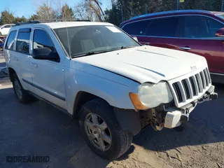 2009 Jeep Grand Cherokee Laredo with VIN 1J8GS48K29C518895, listed as a IAAI auction lot 41161045 with 153,499 mi miles. Bid and sale history available at carsss.com. Image 1.