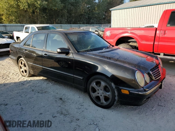 2002 Mercedes-Benz E-Class with VIN WDBJF65J32B494321, listed as a Copart auction lot 77557334 with 198,820 mi miles and Salvage Title. Bid and sale history available at carsss.com. Image 4.