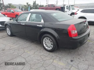 2009 Chrysler 300 LX with VIN 2C3KA43D19H506753, listed as a IAAI auction lot 42053199 with 106,092 mi miles. Bid and sale history available at carsss.com. Image 3.