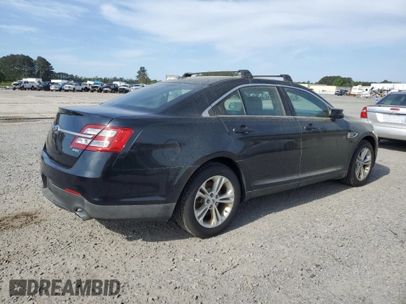 2014 Ford Taurus SEL with VIN 1FAHP2E87EG151866, listed as a Copart auction lot 52692965 with 201,680 mi miles and Clean Title. Bid and sale history available at DreamBid. Image 3.