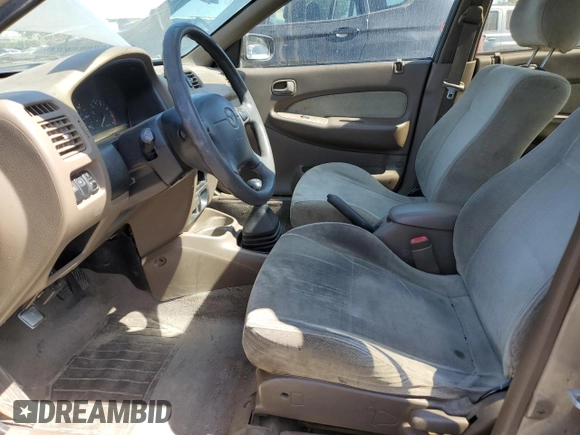 1998 Mazda Protege DX z VIN JM1BC1414W0203670, wystawiony jako Copart lot #62966544 z przebiegiem 249 405 mil mil oraz Szkoda całkowita • Salvage title. Historia ofert i sprzedaży dostępna na DreamBid. Obrazek 7.