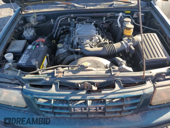 1999 Isuzu Rodeo S with VIN 4S2CK58W1X4349947, listed as a Copart auction lot 84634064 with 135,851 mi miles and Clean Title. Bid and sale history available at DreamBid. Image 12.