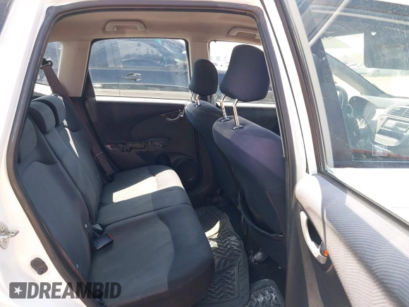 2009 Honda Fit Sport с VIN JHMGE884X9S031777, выставлен на аукционе IAAI как лот 42482823 с пробегом 317 667 миль миль и . История ставок и продаж доступна на DreamBid. Изображение 8.