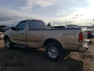 2000 Ford F-150 XL with VIN 1FTRF18L9YKA95457, listed as a Copart auction lot 67083164 with 97,988 mi miles and Salvage title. Bid and sale history available at DreamBid. Image 2.