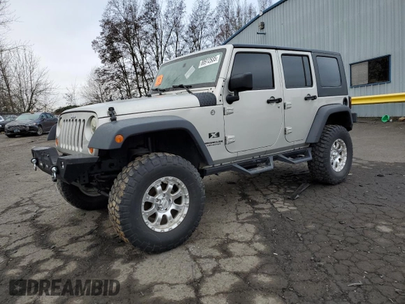2007 Jeep Wrangler Unlimited X with VIN 1J4GA39177L105582, listed as a Copart auction lot 88912935 with 156,156 mi miles and Salvage Title. Bid and sale history available at DreamBid. Image 1.