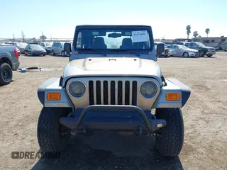 2005 Jeep Wrangler Sport with VIN 1J4FA49S65P342497, listed as a IAAI auction lot 41674606 with 123,457 mi miles. Bid and sale history available at carsss.com. Image 12.