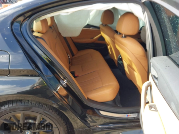 2023 BMW 5 Series 530e with VIN WBA13AG09PCL56556, listed as a IAAI auction lot 42098427 with Not provided miles and . Bid and sale history available at DreamBid. Image 8.