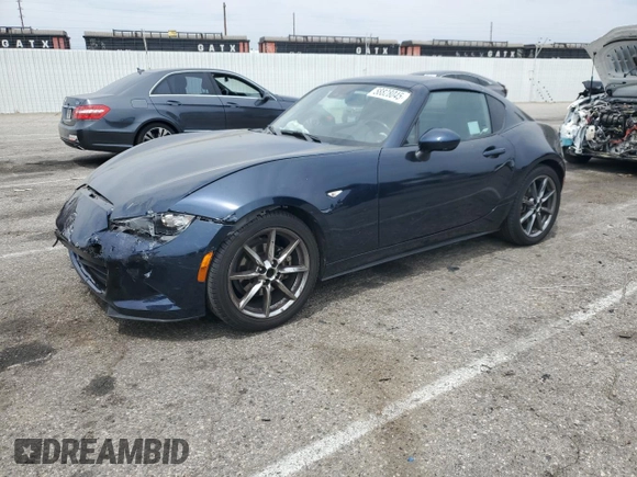 2021 Mazda MX-5 Miata Grand Touring with VIN JM1NDAM70M0460532, listed as a Copart auction lot 58828045 with 70,269 mi miles and Salvage title. Bid and sale history available at DreamBid. Image 1.