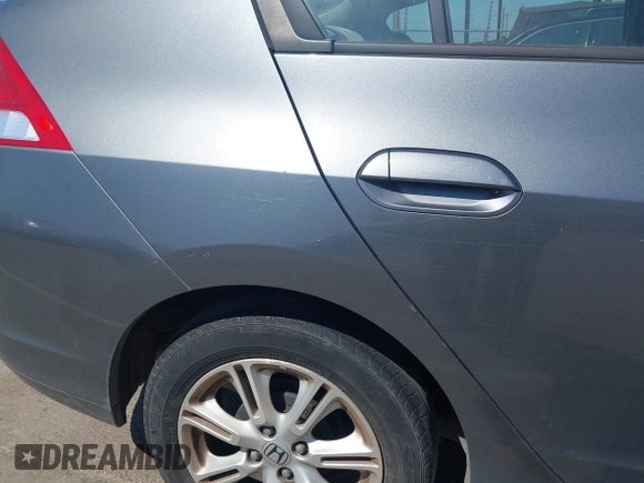 2010 Honda Insight EX with VIN JHMZE2H72AS015870, listed as a IAAI auction lot 42762384 with 58,121 mi miles and . Bid and sale history available at DreamBid. Image 6.